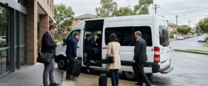 Business delegates boarding a shuttle van, representing corporate shuttle services in Sydney for conference transport